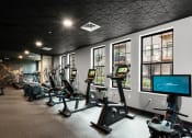 Thumbnail 24 of 53 - a room filled with lots of different types of exercise equipment